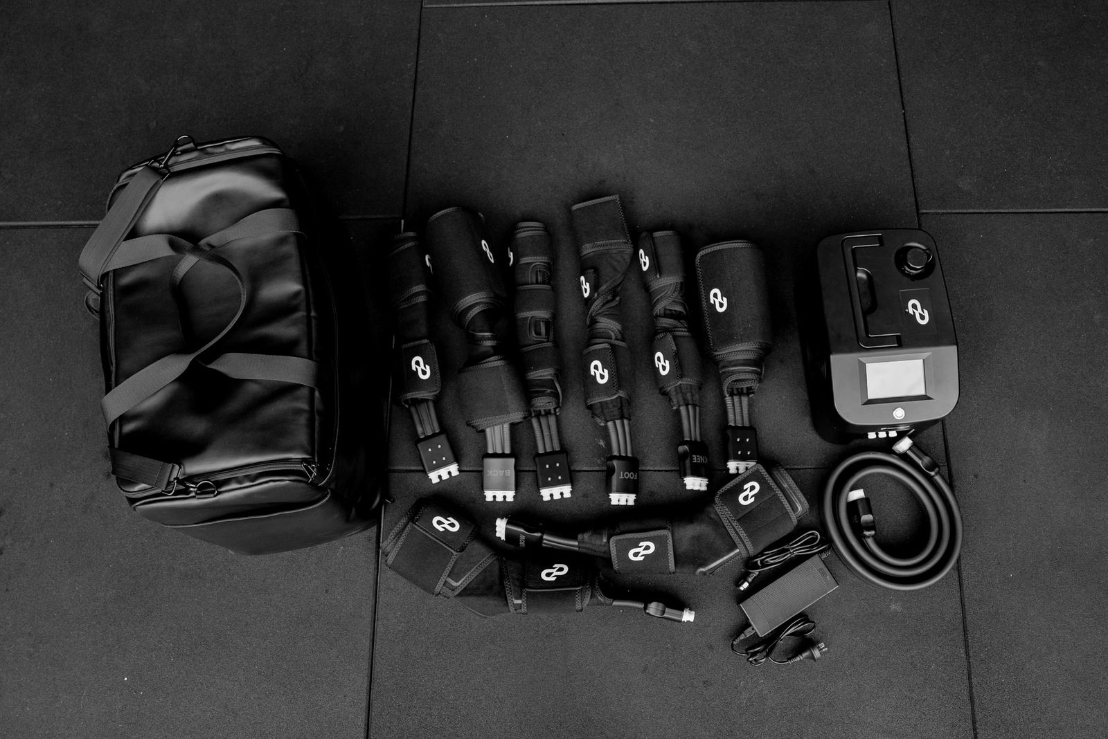The complete Pulse One kit laid out — carry bag, garments, chiller unit and accessories